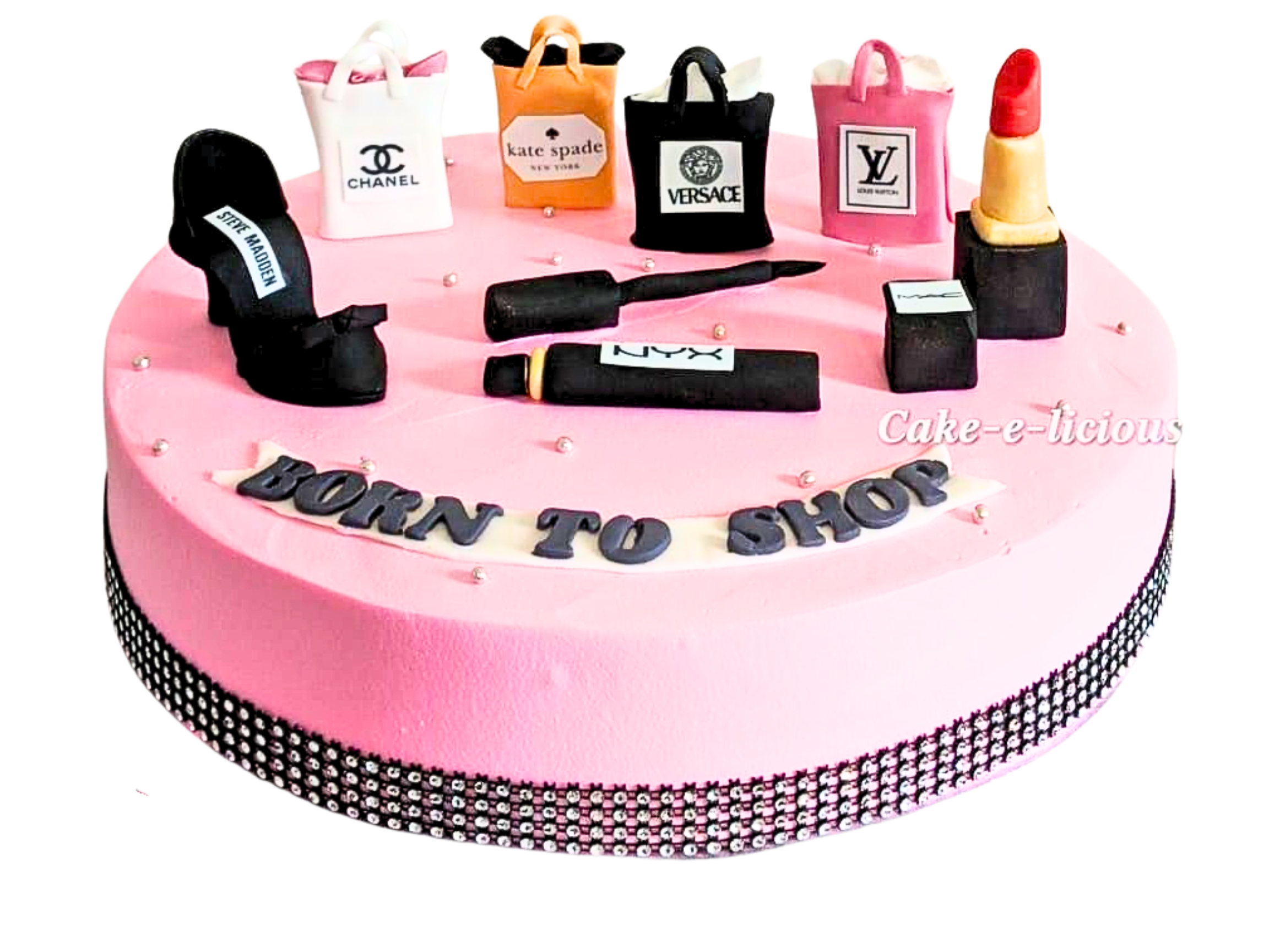 Makeup-themed cake decorated with edible lipstick, eyeshadow, and makeup brushes